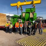 The IRH crew standing in front of a generator at a data center power generator plant.